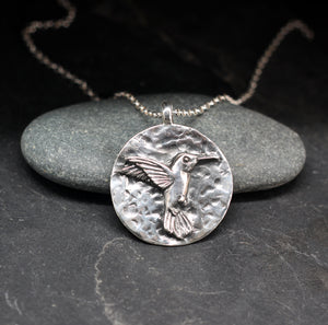 Hummingbird round sterling silver pendant