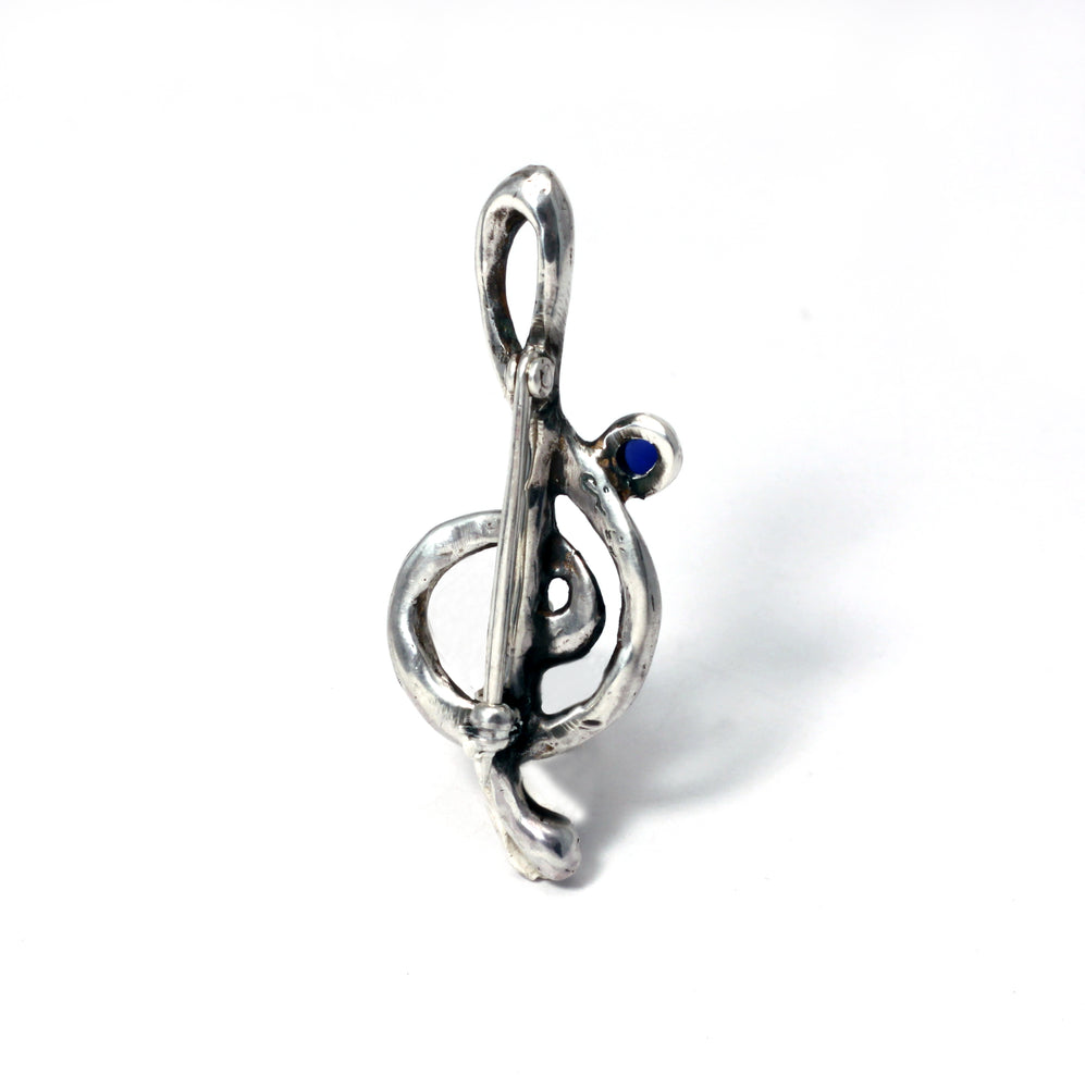 Treble Clef brooch in Sterling silver set with lab grown sapphire