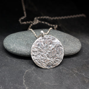 Hummingbird round sterling silver pendant