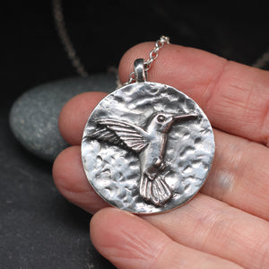 Hummingbird round sterling silver pendant